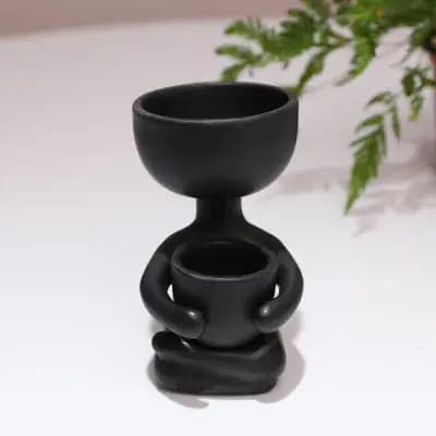Pot de fleur en céramique humanoïde créatif