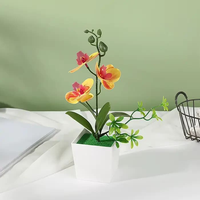 Fleurs artificielles de Phalaenopsis en pot pour une décoration élégante
