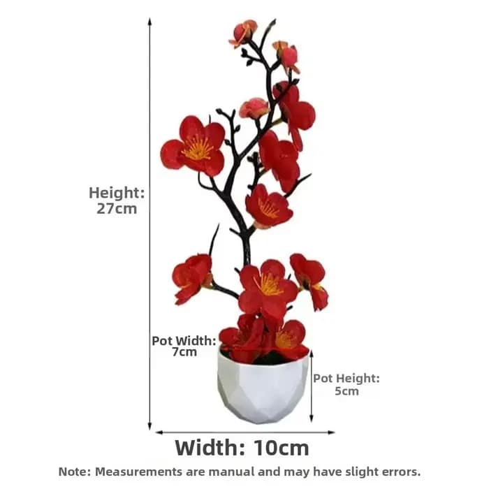Petite plante artificielle de fleurs de prunier rouges en pot avec pot blanc